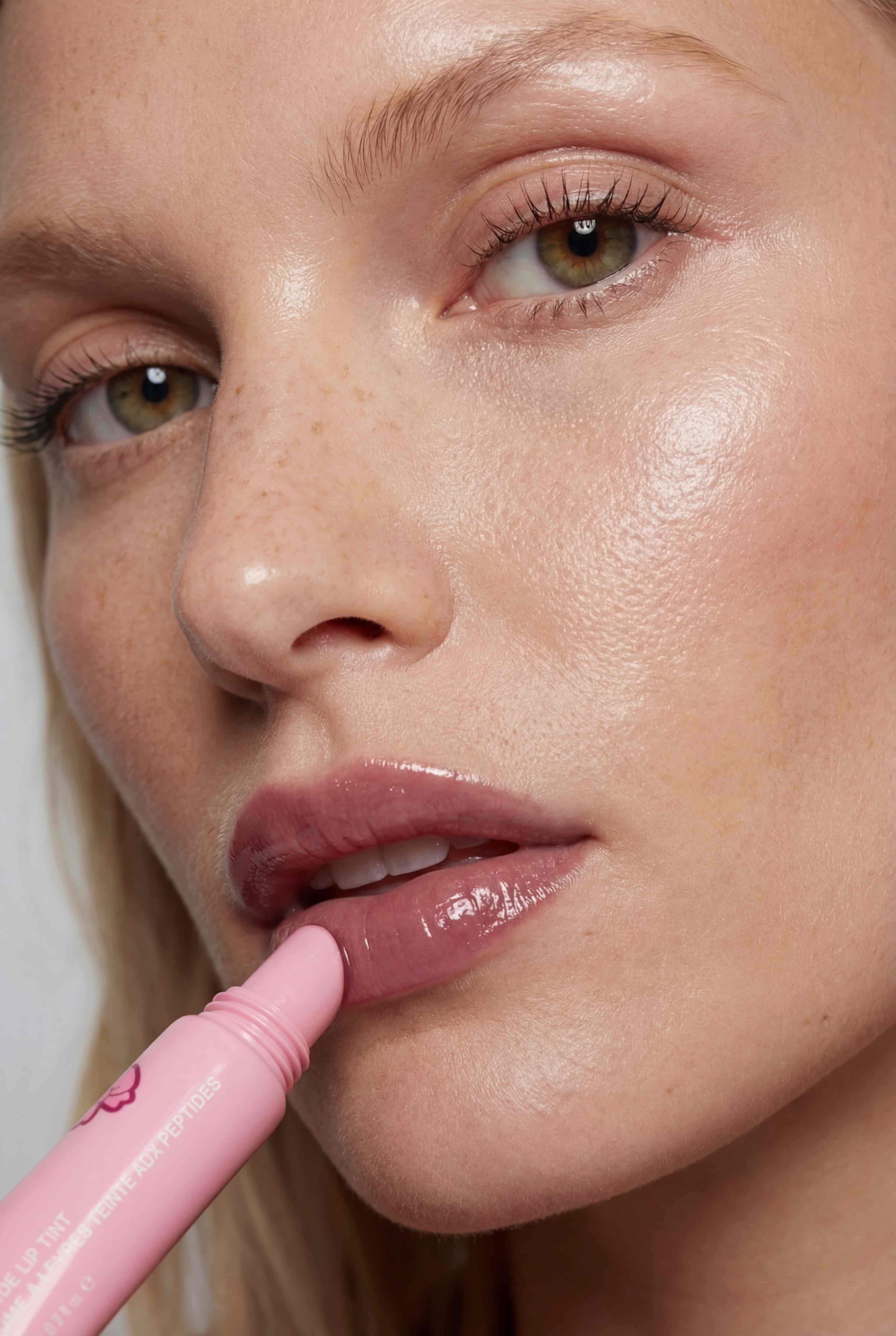 Beauty product photography - close-up lip gloss application